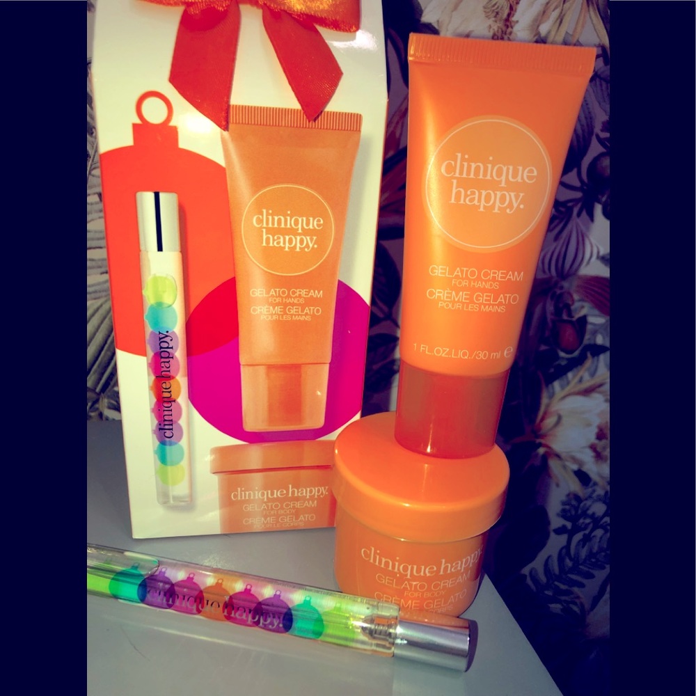 Clinique Happy travel size body cream, hand cream and perfume.